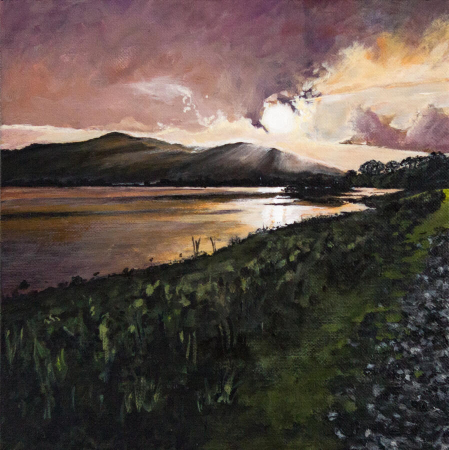 Landscape painting of a golden sunset over a calm reflective lake, with rolling dark hills in the distance, a glowing purple-orange sky, and a grassy shoreline path leading along the water’s edge.